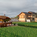 Ancient Architecture With Scenic View Of Green Wheat Field And Traditional Rural Houses