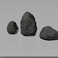 Three Gray Natural Stones with Rough Surfaces and Various Shapes on Reflective Base