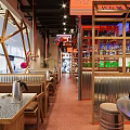 Korean Restaurant Interior With Neon Signs Brass Decor Dining Tables And Red Floor Tiles