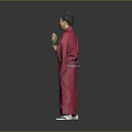 Man In Red Kimono Holding A Folding Fan Against Gray Background
