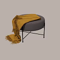 Stylish Gray Round Ottoman with Brown Fringed Blanket and Black Metal Legs