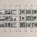 Modern Wall Decor With Grid Arranged Photo Frames Black White Photos And Geometric Patterns