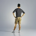 Man in Gray Short Sleeve Shirt and Khaki Shorts Standing with Hands on Hips
