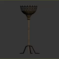 Vintage Metal Floor Candlestick With Intricate Hollow Top And Three Legged Base
