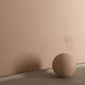 Elegant Beige Wall With Subtle Textures And A Matching Sphere