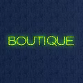 Green Neon Decorative Light With BOUTIQUE Text On Dark Blue Background