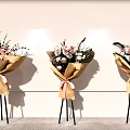 Floral Display With Paper Wrapped Bouquets Pink Ribbons And Tripod Stands