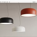 Modern Dome Shaped Pendant Lights in Black Red White Hanging Against Textured Wall