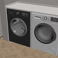 Black and White Front Load Washing Machines in Modern Laundry Room With Wooden Floor