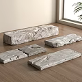 Natural Stone Slabs Arranged On Wooden Floor In Bright Indoor Space With Green Plant