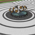 Modern Metal Sculpture With Circular Geometric Shapes In Outdoor Plaza With Fountain And Trees