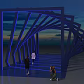 Modern Event Entrance With Blue Illuminated Geometric Structure And People Walking At Sunset