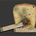 Sliced Moldy Bread With Green And Orange Mold Spots On Surface
