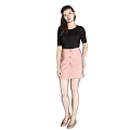 Elegant Woman In Black Top And Pink Plaid Skirt With High Heels