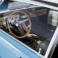 Classic Blue Two Door Car With White Roof And White Rims On Black Background