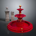 Red Multi Tiered Fountain With Stone Pillars And Ornate Gold Details