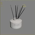 White Ceramic Home Fragrance Bottle With Black Reed Sticks And White Jasmine Scent