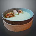 Ceramic Bowl With Green Soup Placed On Woven Mat As Daily Kitchen Utensil
