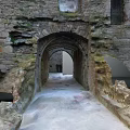 Historic Medieval Archway Scenery With Ancient Stone Walls And Ruined Stone Pathway