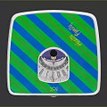 Square Device With Blue Green Striped Pattern And Circular Control Panel