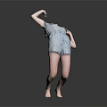 Child Performing Dance Move In Blue Denim Romper Barefoot On Gray Background