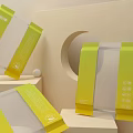Yellow Transparent Packaging Bags on Beige Geometric Display Stands with White Small Balls