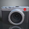 Leica Digital Camera With Silver Body Gray Accents And Classic Lens Design