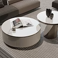Modern Round Coffee Tables With White Sleek Surface Magazines Mug And Decorative Vases