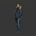 Man In Blue Coat With Fur Collar Black Turtleneck Blue Jeans Green Shoes Gray Background