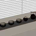 Minimalist Tea Tray Setup With Teapot And Four Cups By Window Blinds
