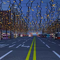 Decorative Lights Over Night Street With Yellow Glow Blue Sky Buildings And Vehicles