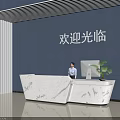 Modern Marble Reception Desk With Computer Welcome Sign And Blue Wall In Lobby