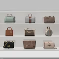 Various Stylish Handbags In Different Styles And Colors Displayed On White Shelves