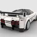 White Streamlined Sports Car Built with Building Blocks Featuring Yellow Headlights Black Roof and Spoiler