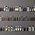 Various Colored and Shaped Wine Bottles and Glasses Arranged Neatly in Rows