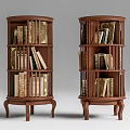 Round Wooden Bookcases With Multiple Shelves Filled With Books And Ornate Legs