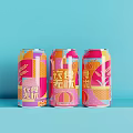 Three Vibrant Canned Drinks With Geometric Patterns On Light Blue Background