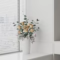 White Textured Vase With Beige Roses And Green Eucalyptus Leaves By Window Blinds