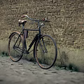 Classic Vintage Bicycle Leaning Against Old Brick Wall On Cobblestone Path 3d model