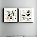 Two Decorative Geometric Paintings With Triangles Diamonds Various Colors Black Frames Hanging On Light Wall 3d model