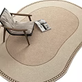 Stylish Shaped Beige Rug With Decorative Edge In Living Room With Armchair And Magazine