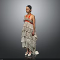 Woman in Strapless Beige Layered Dress with Red Accents White High Heels on Gray Background