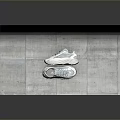 Modern Stylish Sports Shoes With White And Gray Design On Concrete Surface