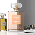 Chanel Luxury Perfume Collection Showcasing Coco Mademoiselle N°5 Bottles With Elegant Rose Accents