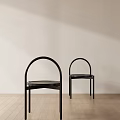 Black Console Table With Arched Metal Frame And Round Top In Minimalist Design