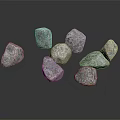 Several Natural Gray Stones With Rough Surface Texture On Dark Background
