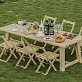 Outdoor Wooden Dining Table And Chair Set On Green Grass With Food Drinks And Fruits