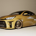 Golden Toyota Sporty Hatchback With Black Grille And Alloy Wheels