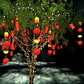 Art Installation Featuring Tree Adorned With Red Lanterns And Illuminated Light Beams