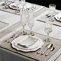 Elegant Dinnerware Set with White Plates Napkins Cutlery and Glass Goblets for Formal Table Setting